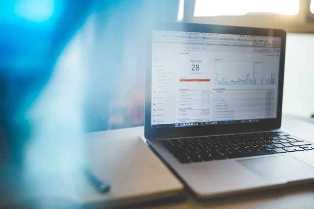 Laptop displaying Google Analytics in a modern workspace, highlighting digital analytics and technology. Email marketing software strategy: campaign governance